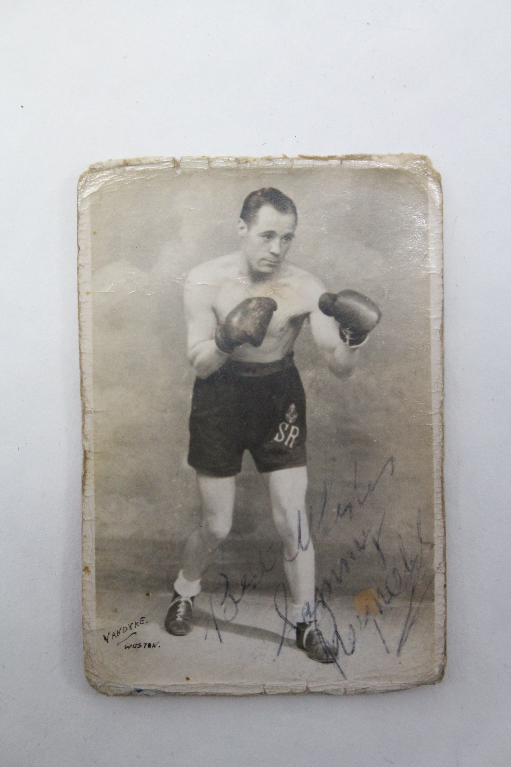 A mid-20th century autographed photograph of the boxer Sammy Reynolds, 3½” x 2¼”, un-framed