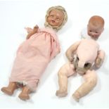 An Armand Marseille bisque-head baby doll (A. M. Germany 351/5k) with blue sleeping eyes, open