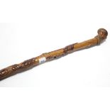 A Chinese carved bamboo walking cane inscribed: “HMS GNAT 1936 SHANKAI CHINKIANG NANKING WUHU