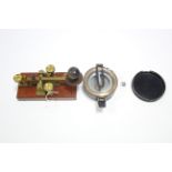 A Stanley of London compass in black lacquered brass case, 3½” diam.; & a Walters Electrical Co.