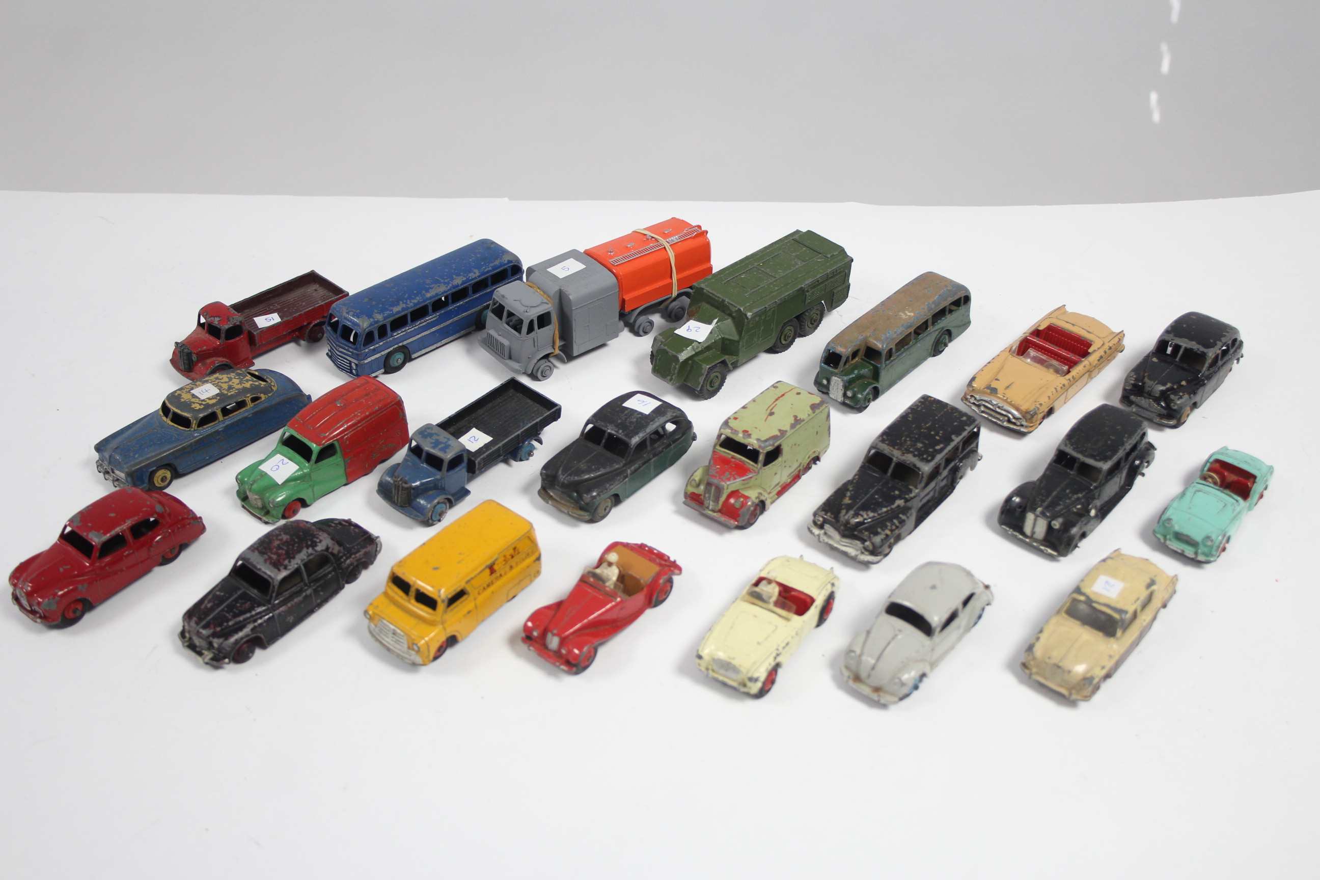 Twenty two various Dinky scale model vehicles, all un-boxed