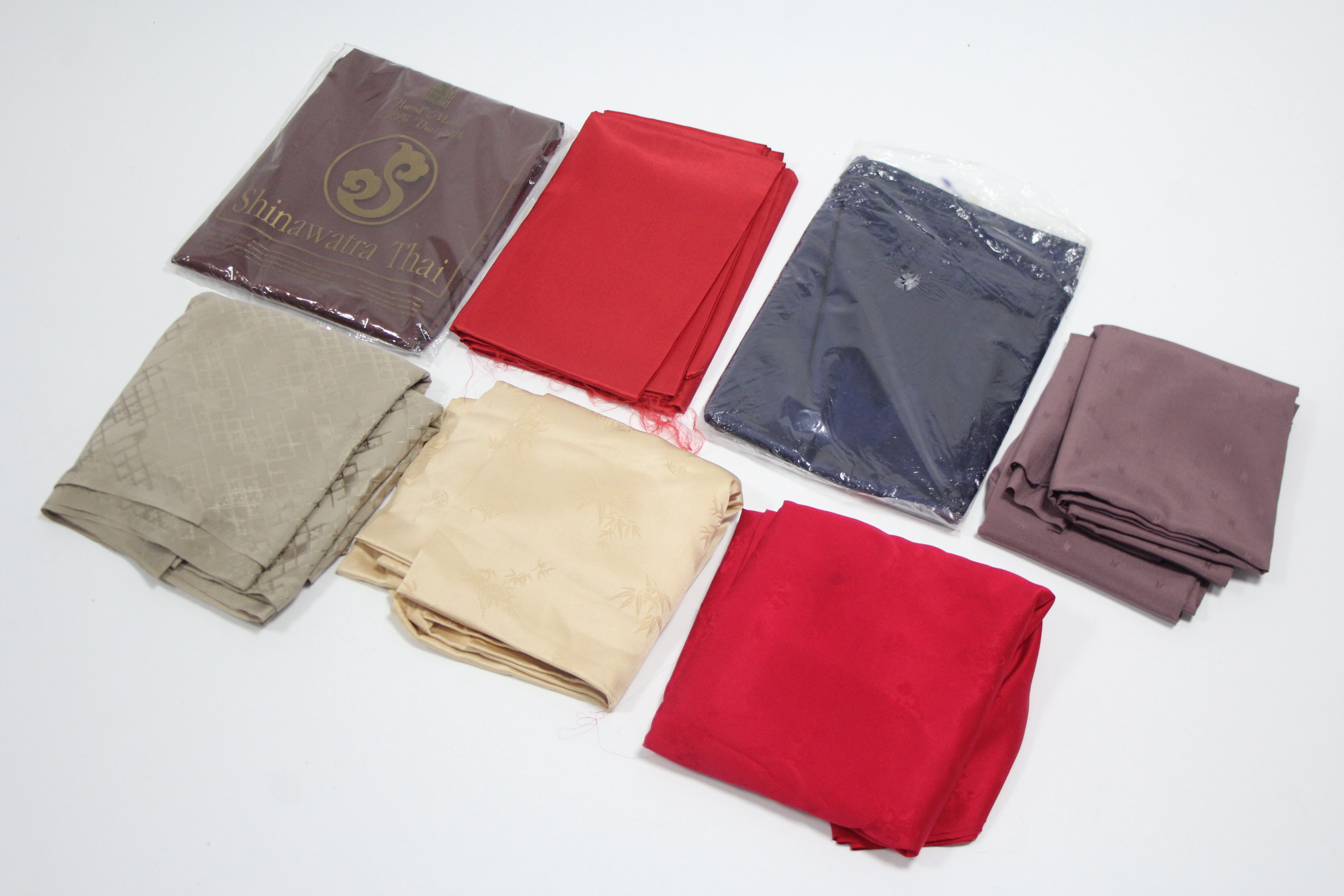 Seven various lengths of eastern reflective silk material (various sizes).