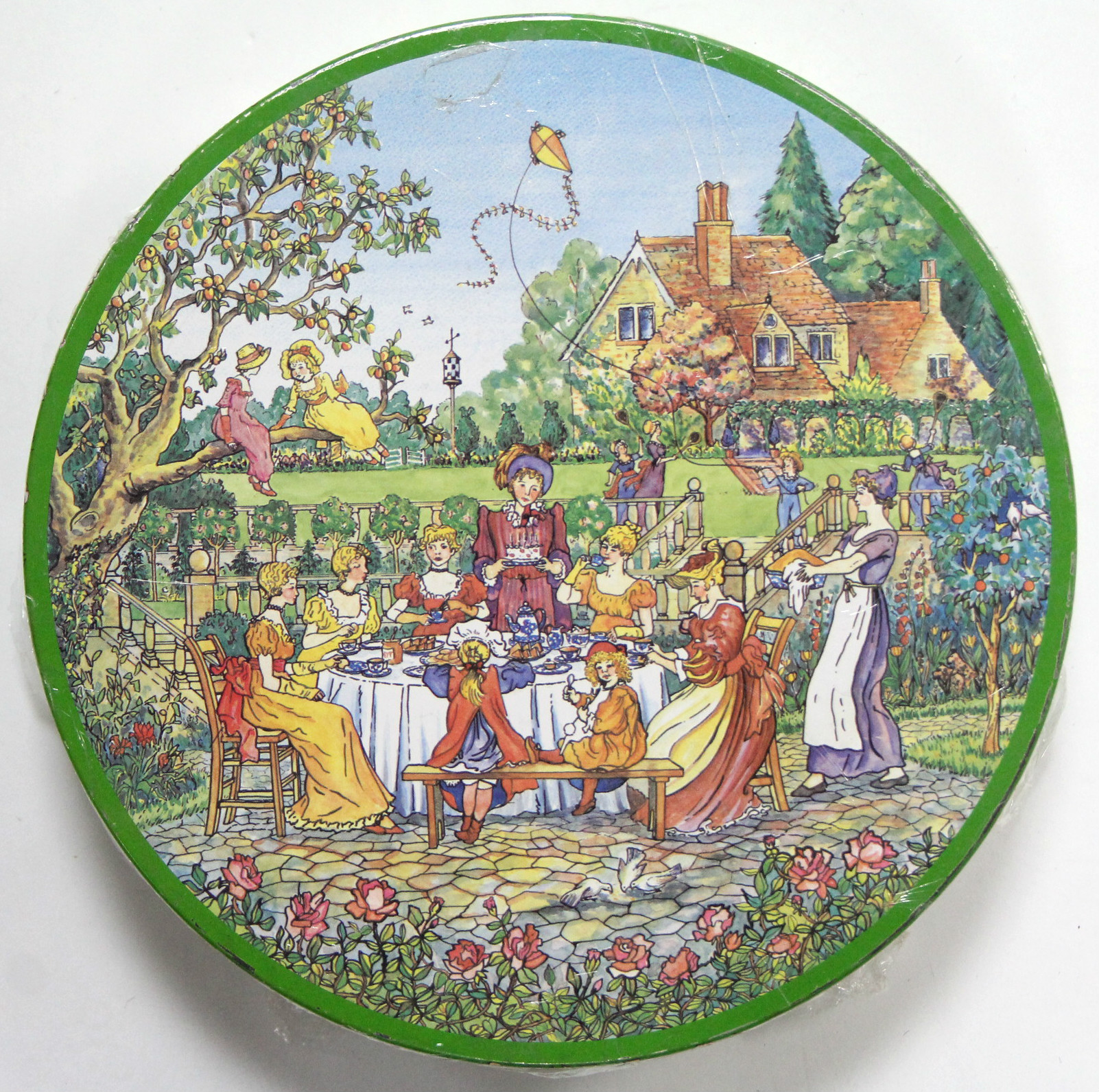 A HUNTLEY & PALMERS “NAUGHTY” BISCUIT TIN, COMPLETE WITH ORIGINAL CONTENTS, the circular tin