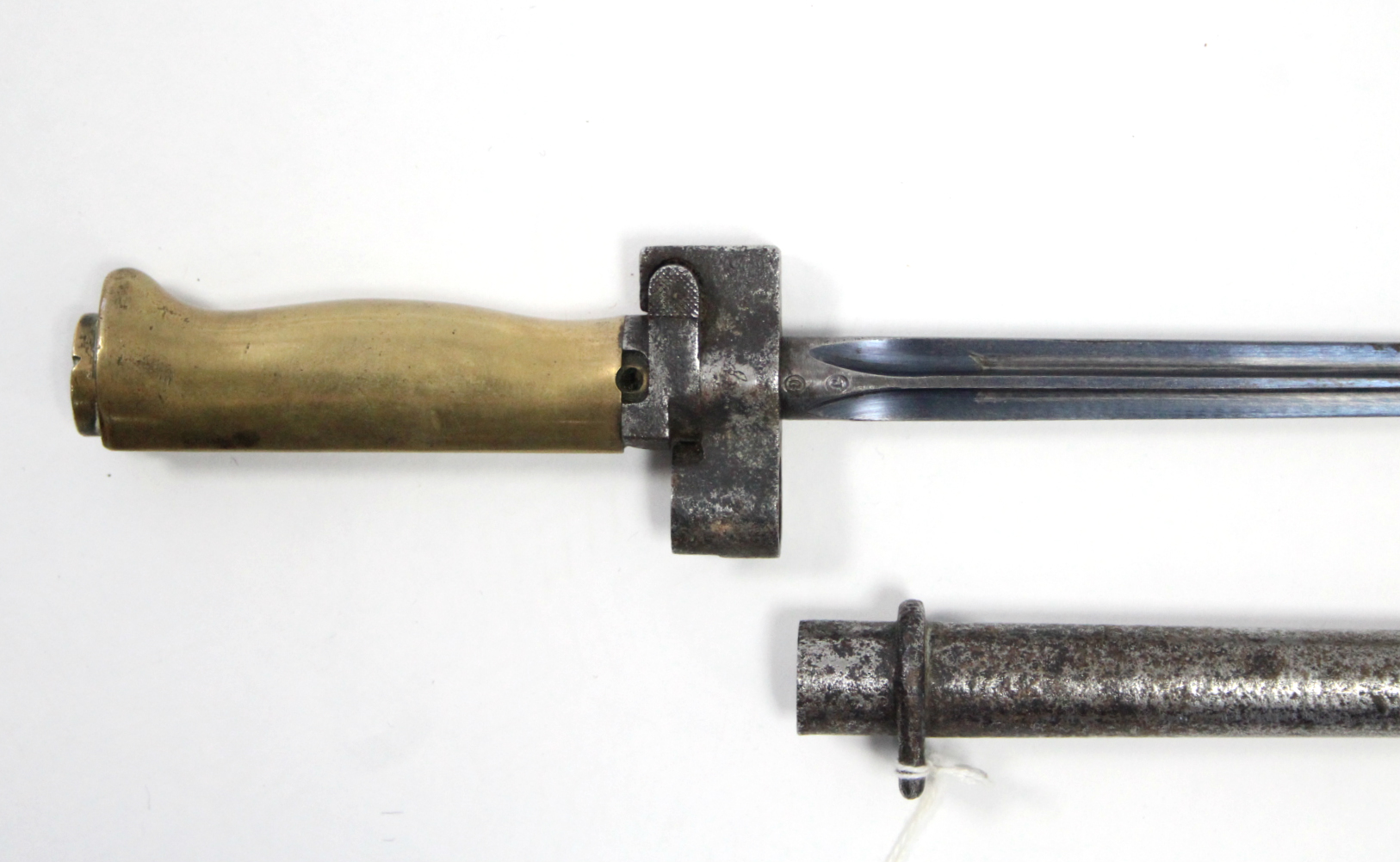 A WWI FRENCH RIFLE BAYONET, with 20½” long bade stamped “J. G.” with brass grip, & steel scabbard.