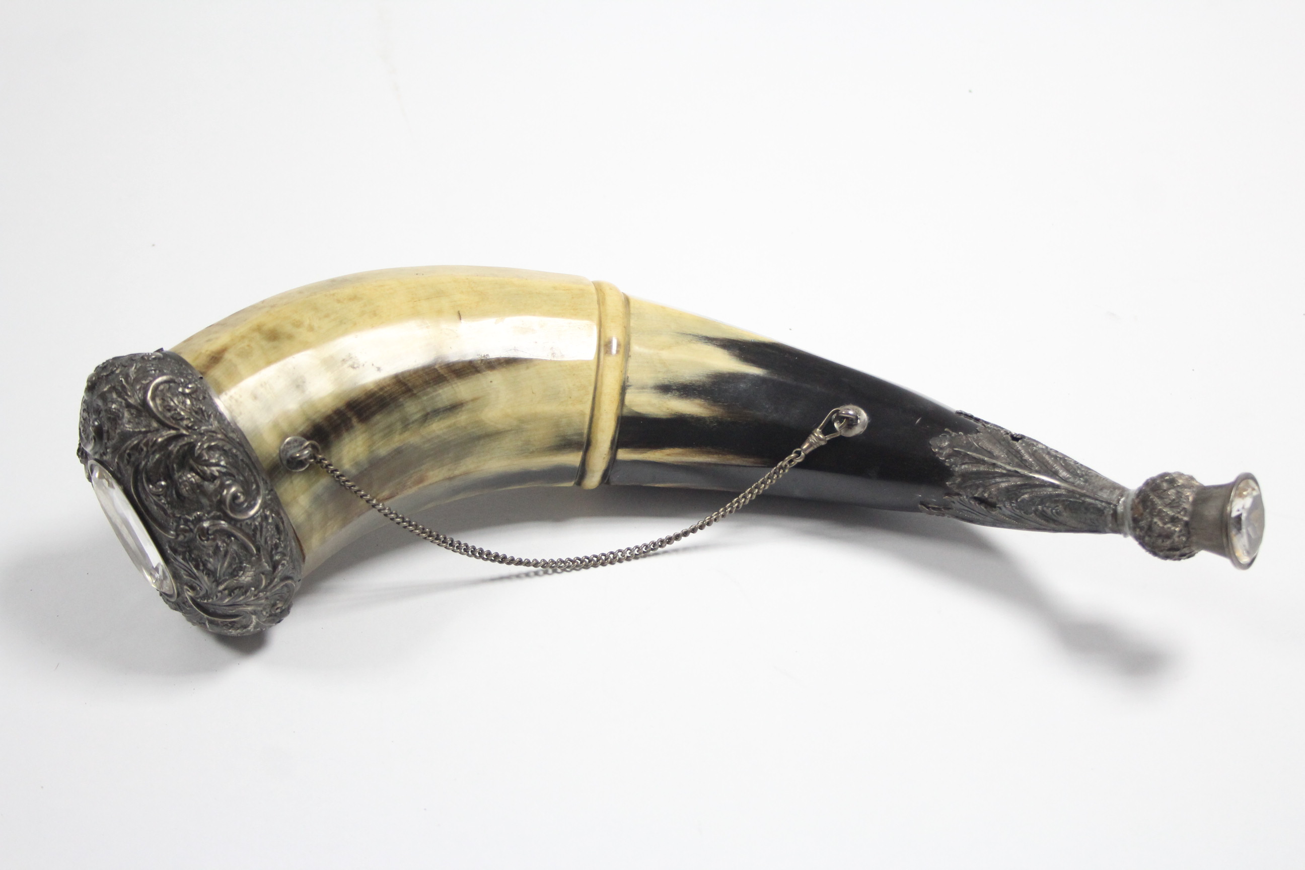 A Scottish large horn mull with white-metal mount to each end set with synthetic stone, 15½” long.