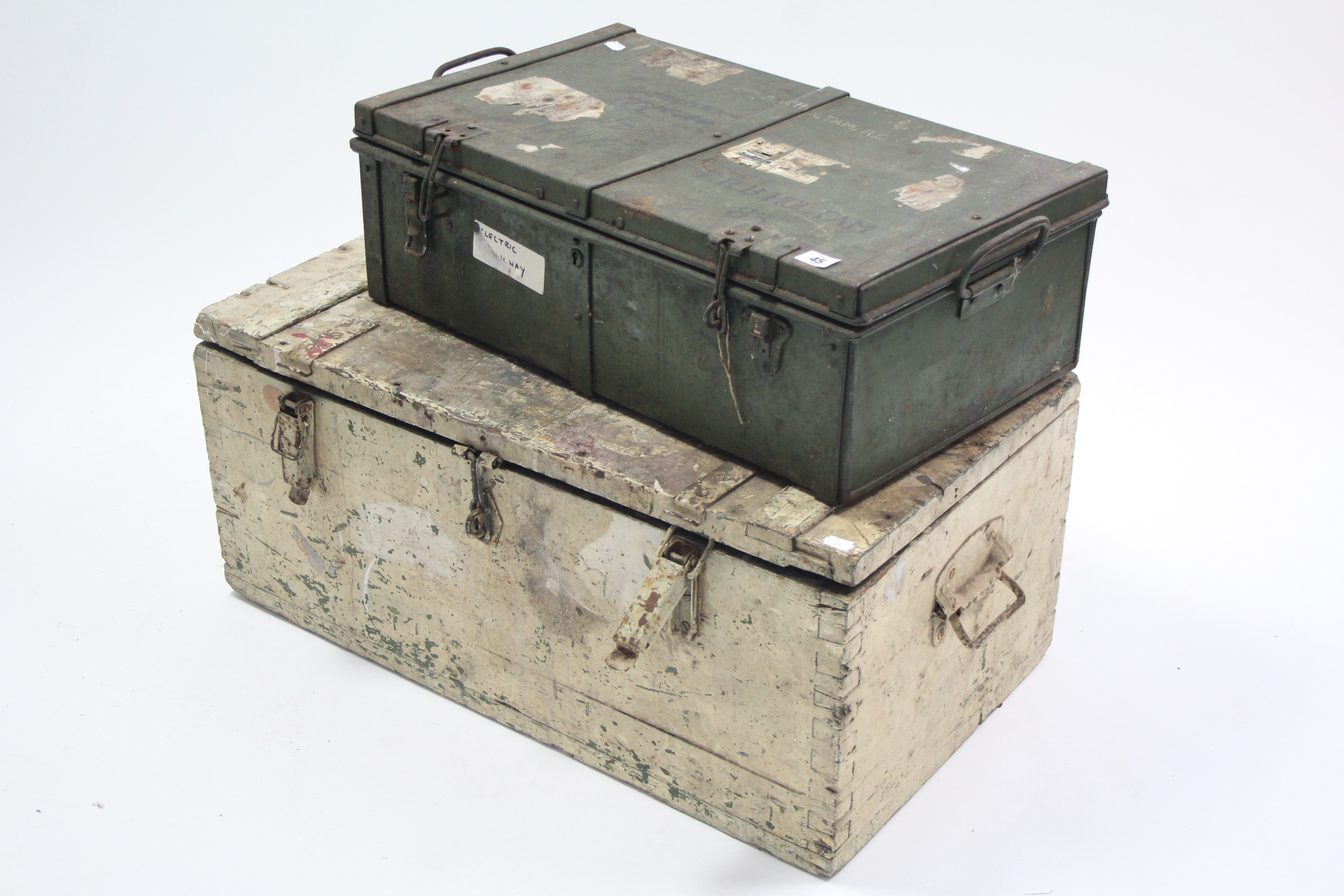 A green-finish metal small travelling trunk with hinged lift-lid and with wrought iron side handles,