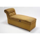 An early-mid 20th century box-seat day bed with scroll end upholstered bronzed material, 58” long.