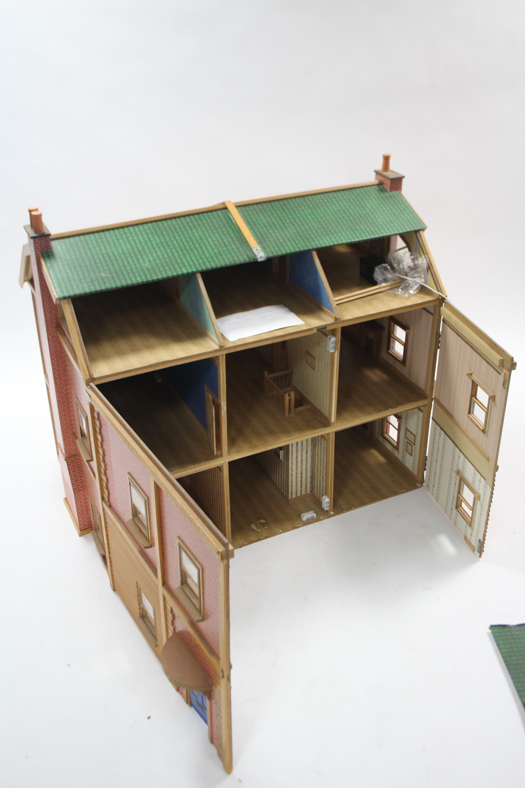 A large paper-covered wooden two-storey doll’s house with opening front & with electrical - Image 2 of 2