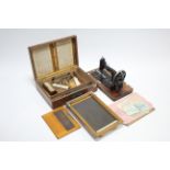 An Ellams self-rising duplicator in mahogany case; & a Frister & Rossmann hand sewing machine,