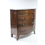 A VICTORIAN MAHOGANY BOW-FRONT CHEST fitted two short & three long graduated drawers with brass