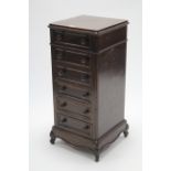 A late 19th/early 20th century continental walnut small upright chest, fitted six long drawers