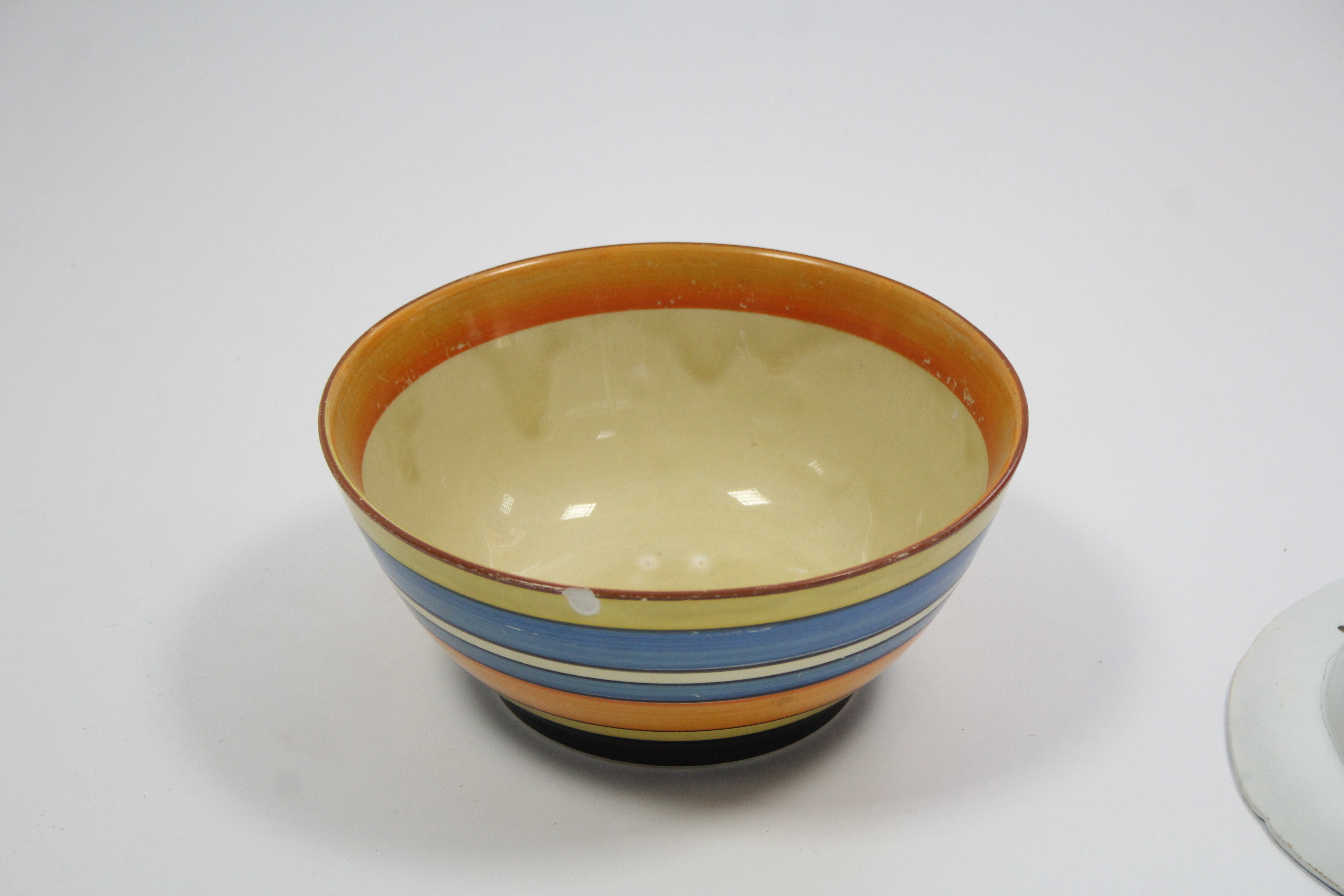 A Clarice Cliff “Fantasque” deep bowl painted with coloured horizontal bands to the exterior, 8½” - Image 3 of 3