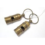 Two reproduction brass “White Line Titanic” whistles.