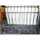 A continental-style green & gold painted wrought-metal 5’ 6” bedstead of scroll design.