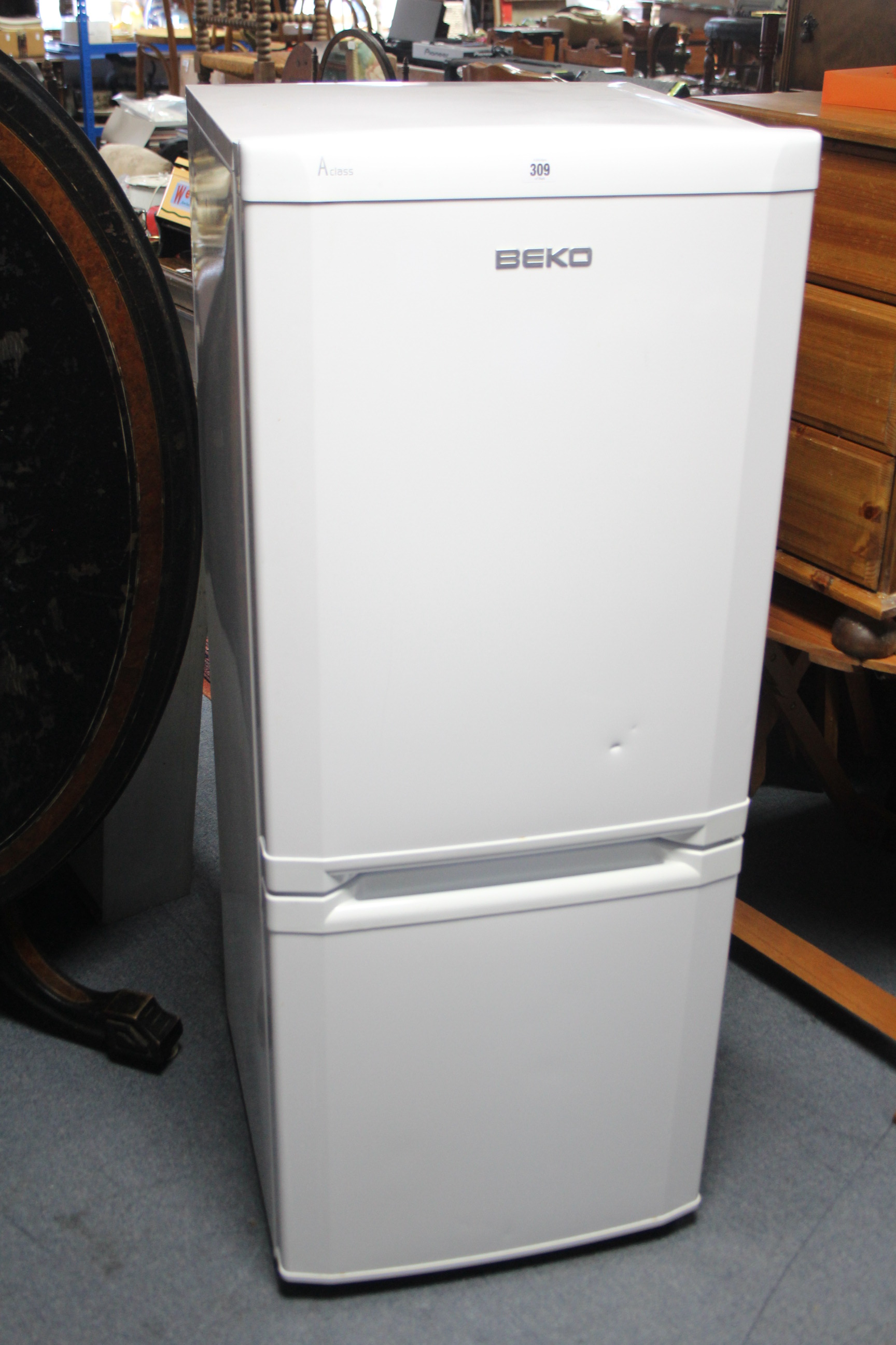 A Beko A class small upright fridge-freezer in white-finish case, 53½” high, w.o.