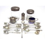 A George V silver three-piece condiment set. Birmingham 1922; two glass receptacles with silver