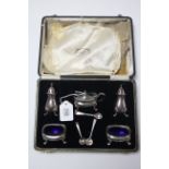 A George VI silver five-piece condiment set. Birmingham 1941, cased.