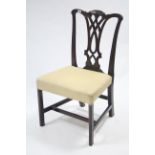 A Georgian mahogany dining chair with pierced & shaped splat back, padded seat & on square chamfered