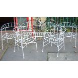 A white painted wrought-metal two-seater garden bench, 50¼” long; & a ditto set of four tub-shaped