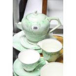 A Paragon bone china green floral decorated twenty-two piece tea service (settings for six); &