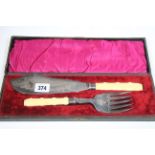 A pair of engraved EPNS fish servers with ivorine handles, cased; & a service of stainless steel