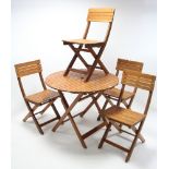 A teak garden table with circular top and on square fold-away legs, 35¼" diam.; and a ditto set of