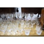 A set of eight heavy cut-glass white wine glasses; a set of nine heavy cut-glass finger bowls; and