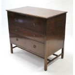 A mahogany chest fitted three long graduated drawers with brass ring handles, & on short square