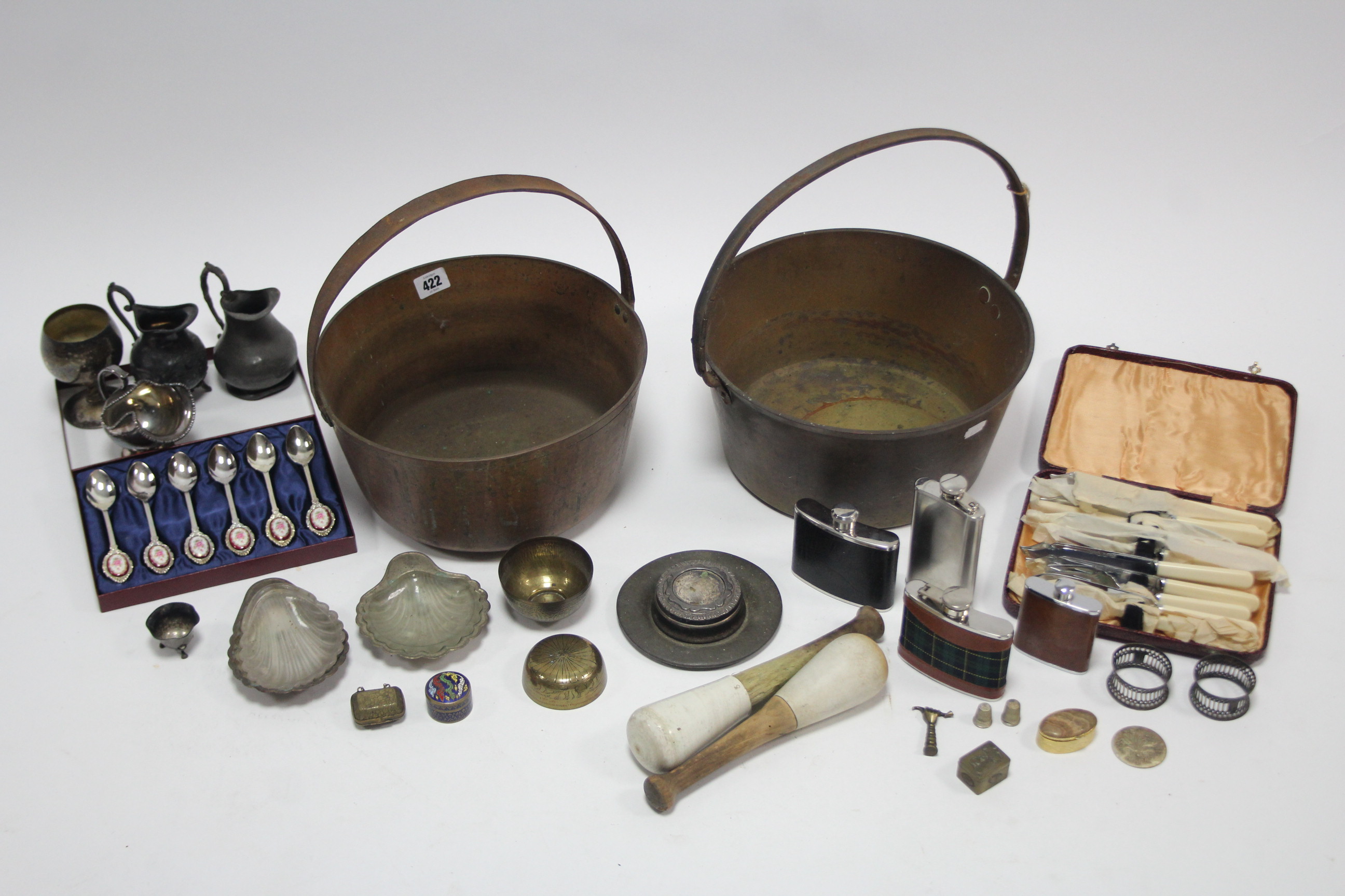 Two brass preserve pans, each with iron handle; a set of plated fish eaters, cased; two pewter cream