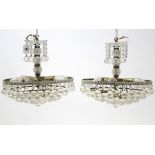 A pair of steel frame ceiling light fittings of five concentric tiers and fitted with cut-glass