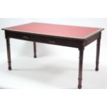 A late 19th/early 20th century oak & pine office table inset crimson leatherette to the