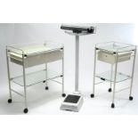 A white-metal finish rectangular two-tier medical trolley fitted two drawers to the upper tier, 29½”