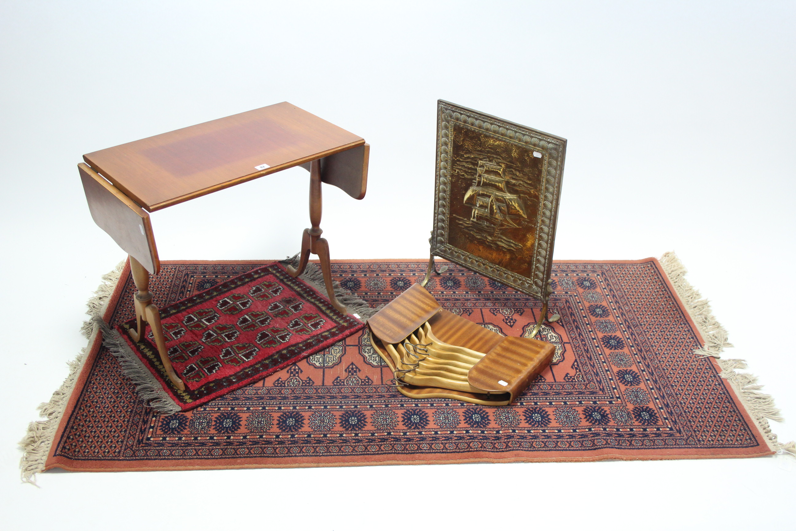 A mahogany rectangular drop-leaf occasional table on turned end supports and cabriole legs, 24"