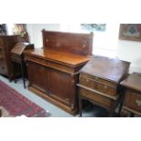 A mid-Victorian mahogany chiffonier, the raised back with applied mouldings, fitted two frieze