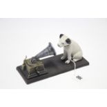 A reproduction painted cast-iron HMV dog with gramophone advertising figure, 4½” high.