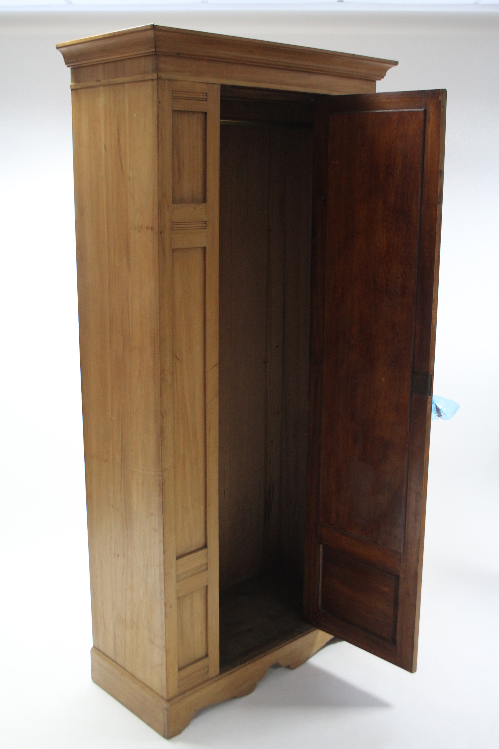 A late Victorian walnut wardrobe enclosed by rectangular mirror door to centre, and on shaped plinth - Image 2 of 2