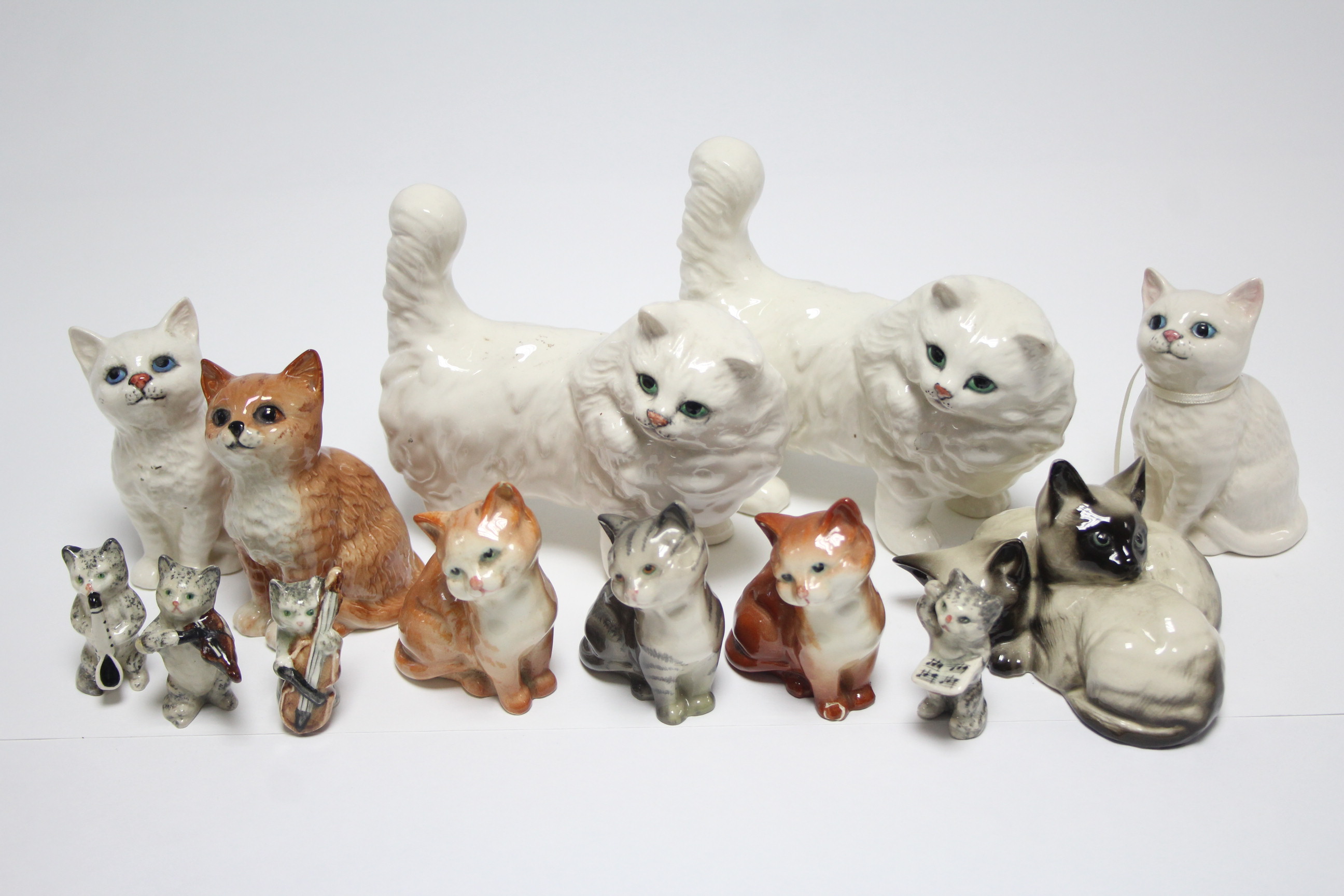 Thirteen various Beswick character cat ornaments.