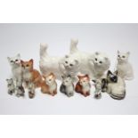 Thirteen various Beswick character cat ornaments.