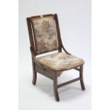An early 20th century beech sewing chair with padded seat & back, fitted drawer below; & on shaped