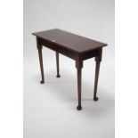 A Georgian mahogany side table with rectangular top, & on round tapered legs & pad feet, 37½” wide.