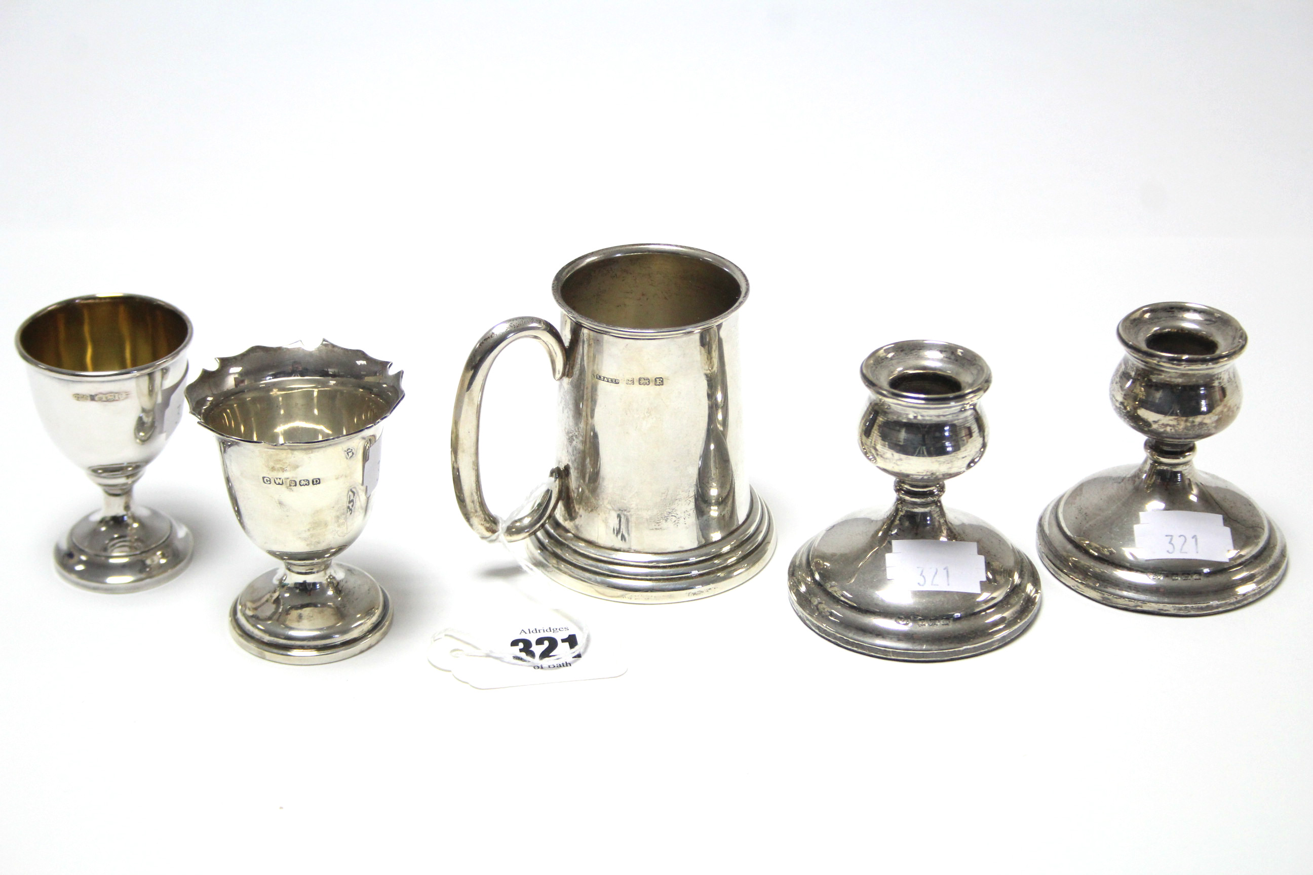 A George V silver christening mug, 2¾” high, Birmingham 1930; a pair of George V silver dwarf