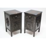 A pair of oriental-style carved hardwood bedside cabinets with figure scene decoration to the