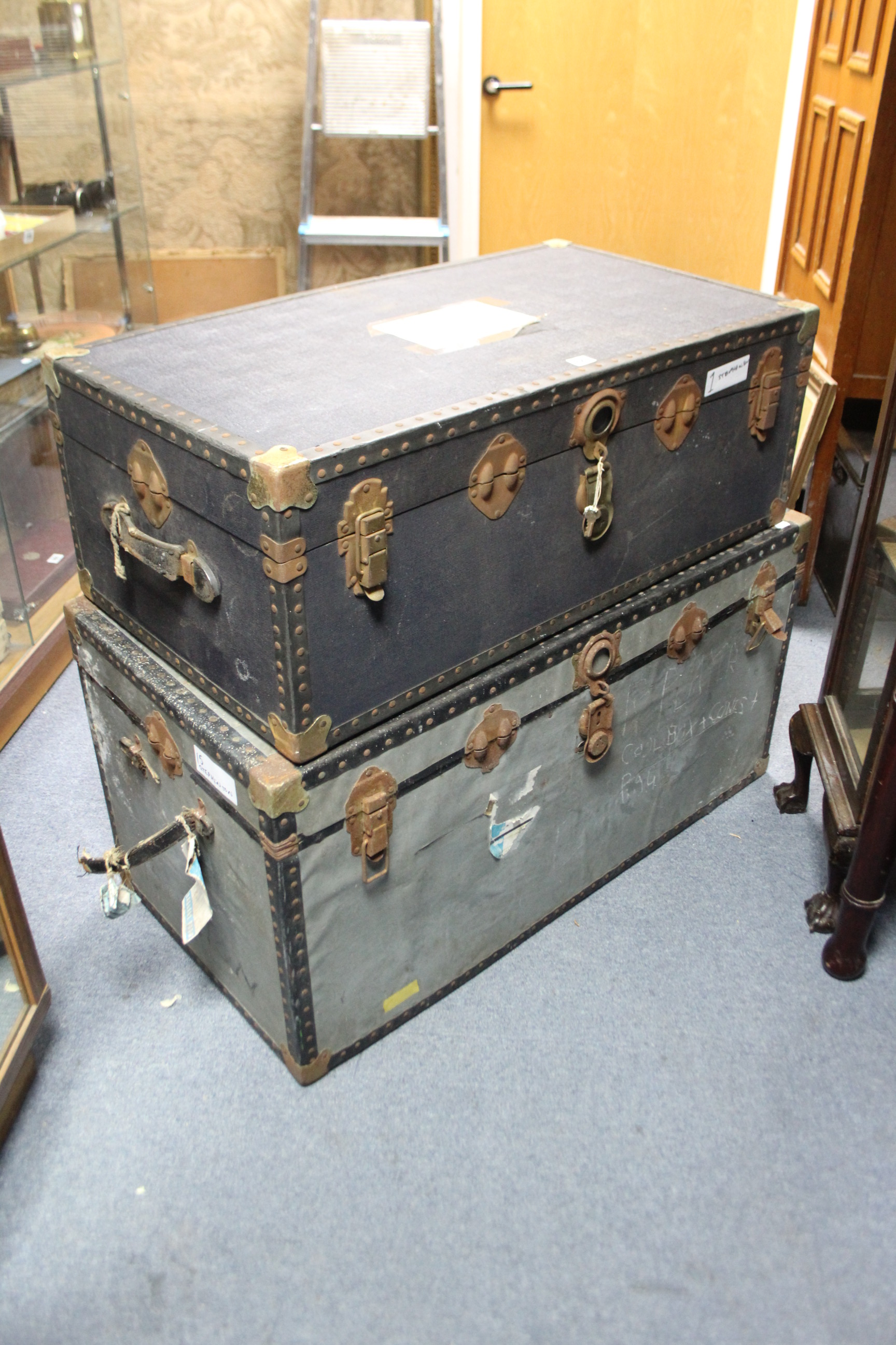 Two travelling trunks, 39¾” & 36” wide; together with a copper warming pan with long turned wooden