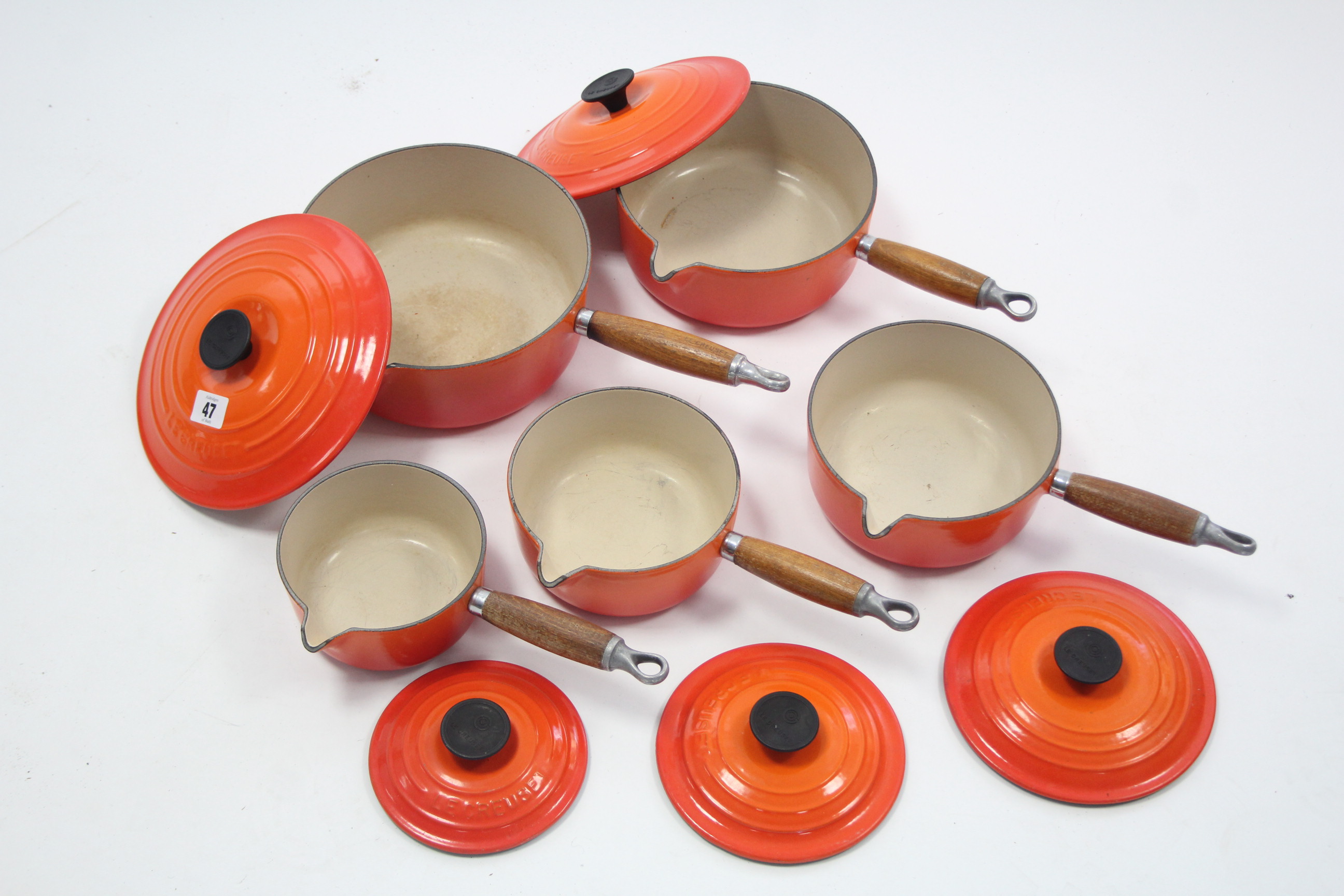 A set of five Le Creuset orange enamelled graduated saucepans, 5¼" - 8¼" diam. - Image 2 of 3