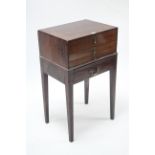 A mahogany side cabinet fitted four long graduated drawers & on square tapered legs, 19¾” wide.