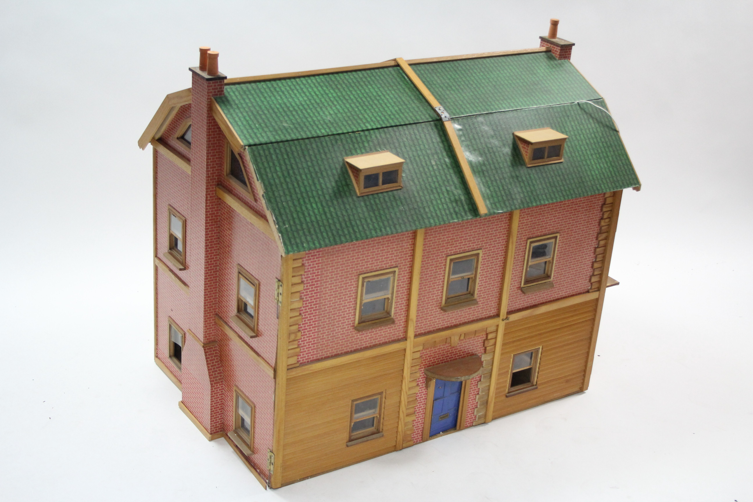 A large paper-covered wooden two-storey doll’s house with opening front & with electrical