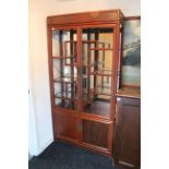 A Chinese hardwood tall china display cabinet (lacking glazed panels to doors & right-hand side),