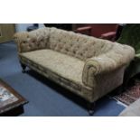A Victorian buttoned chesterfield three-seater settee upholstered multi-coloured floral
