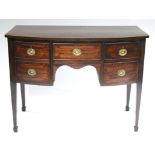 A George III figured mahogany small bow-front sideboard with mahogany crossbanding, fitted five