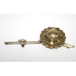 A late Victorian 15ct. gold brooch of circular boss design, Birmingham hallmarks for 1896 (5.8gm); &